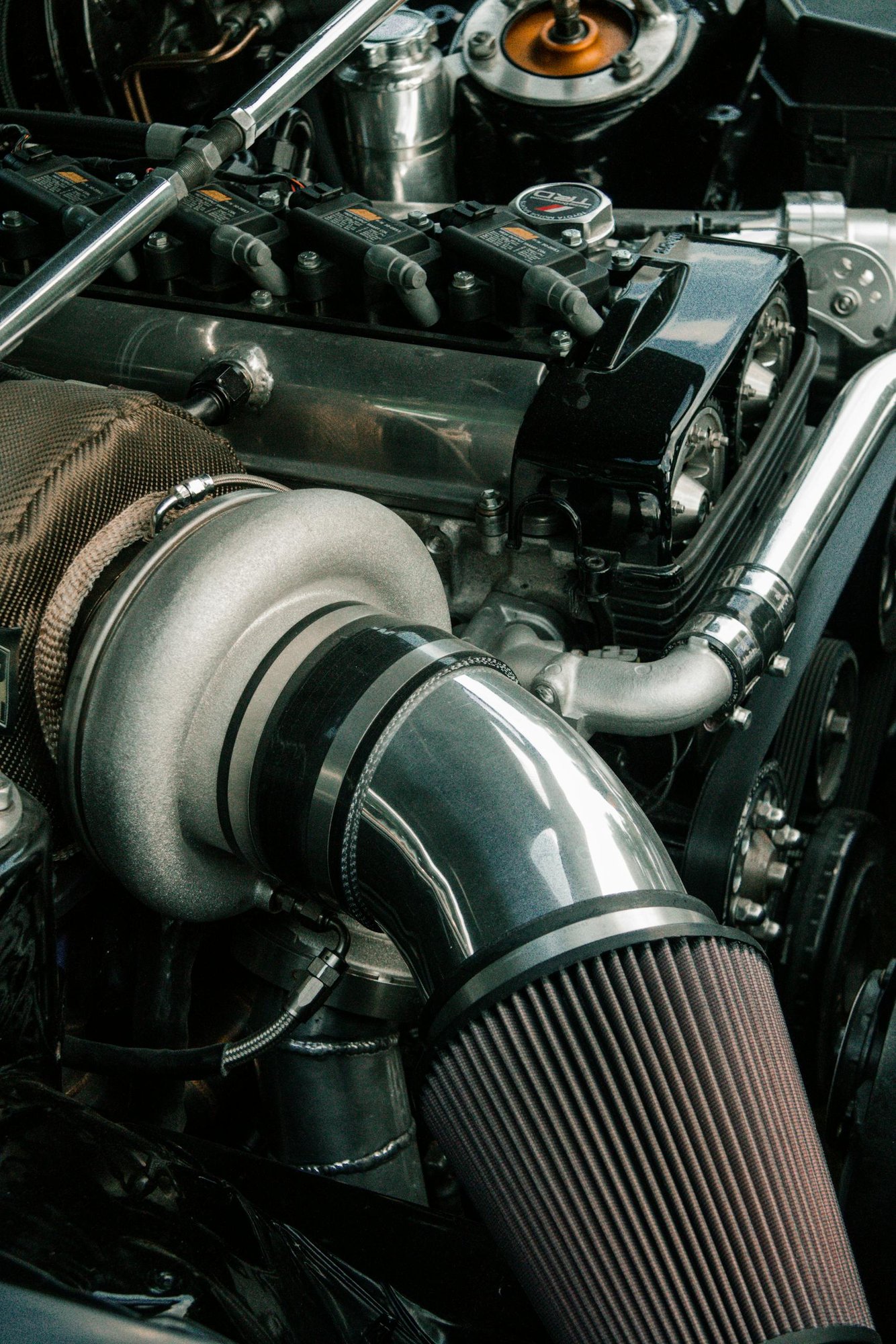 High-resolution image showcasing intricate details of a car engine and its components.